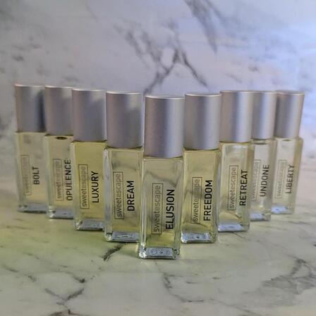a line up of the 9 Sweet Escape perfume oils
